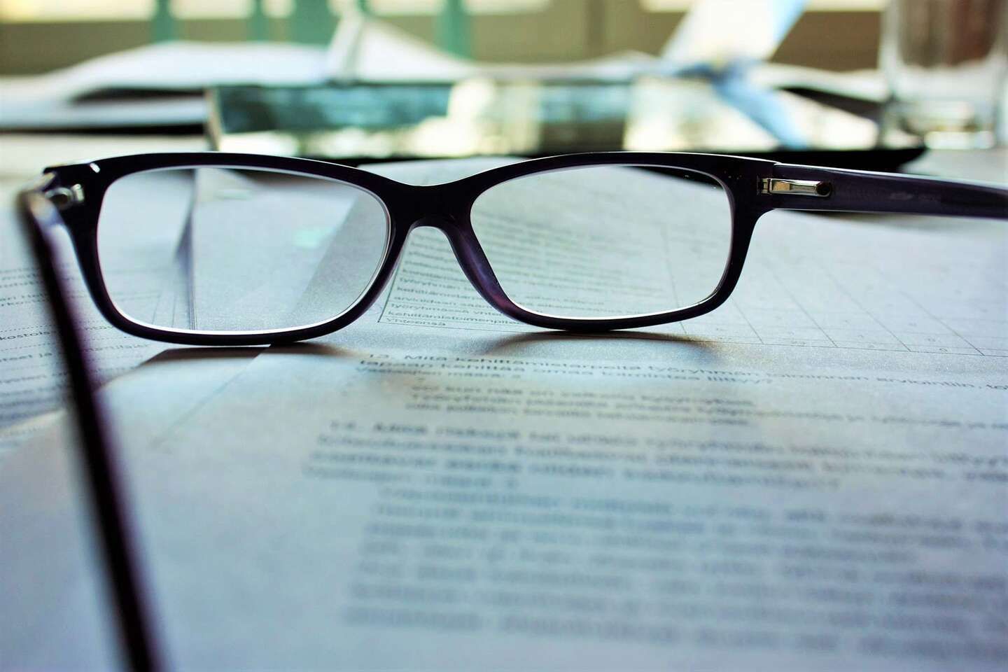 image of freelancer's glasses on graphic design retainer contract