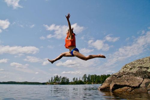 Person leaping in the air celebrating becoming a freelancer