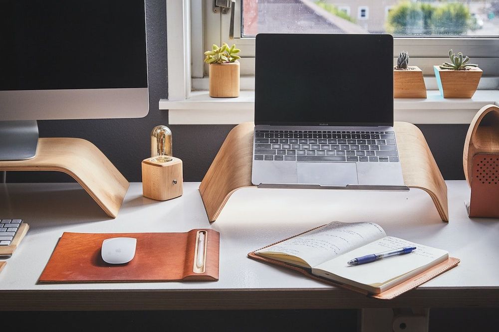 Desk for the laptop is on the table