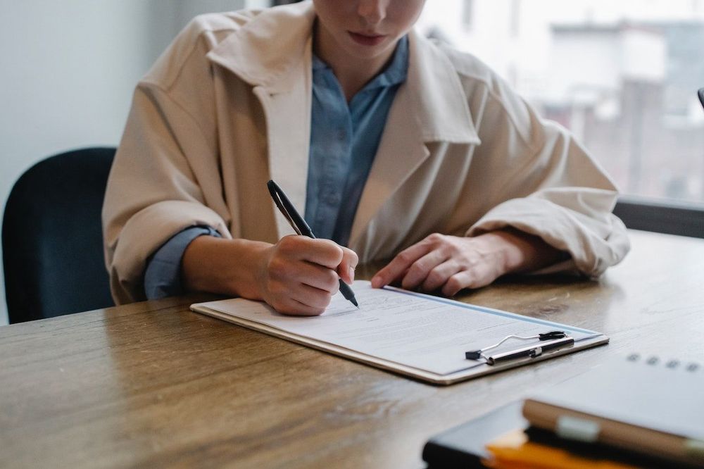 Close-up of a freelance women filling-out brand awareness questioner