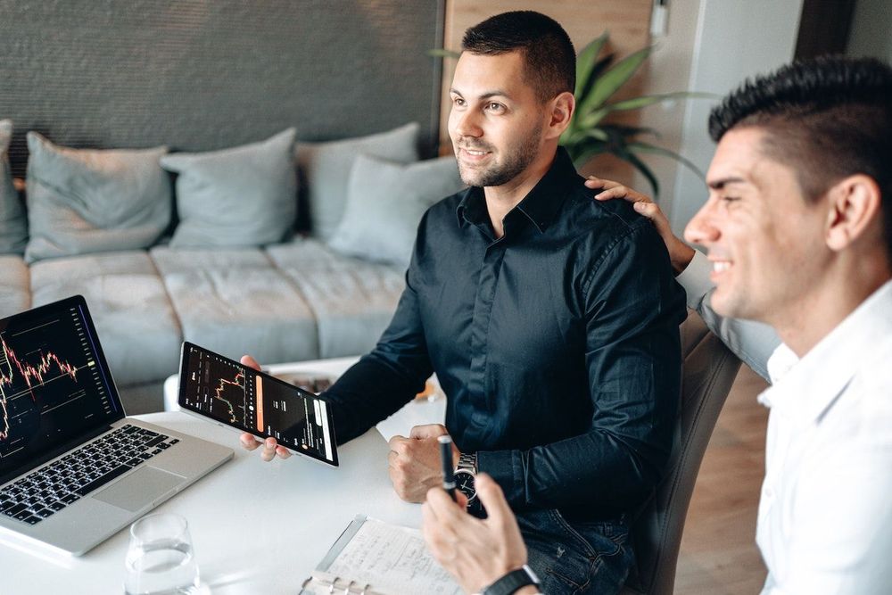 Two men with the laptop are working on SEO strategy 