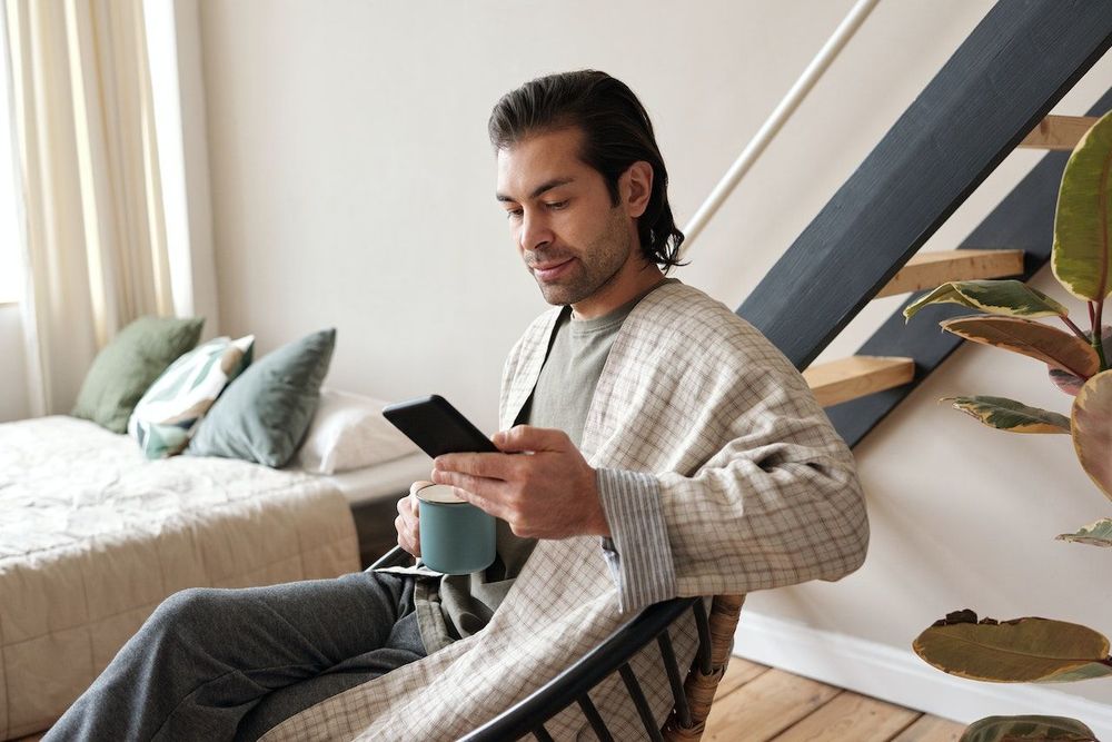 Freelance man is sitting alone at home