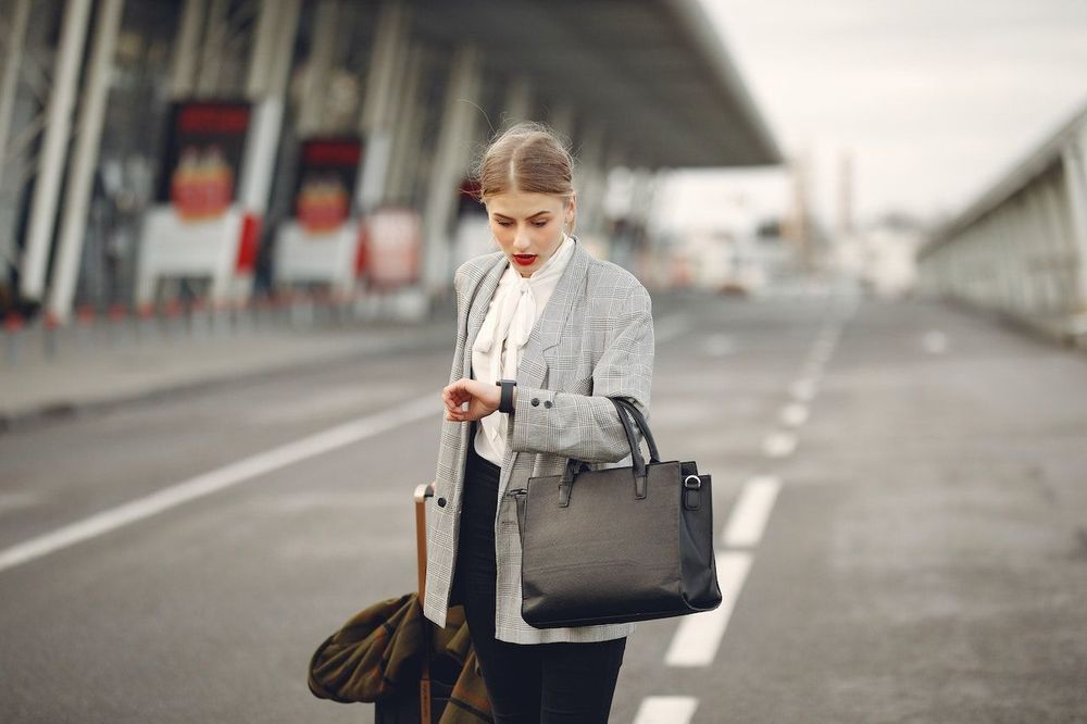 Woman is standing in the centre of airport