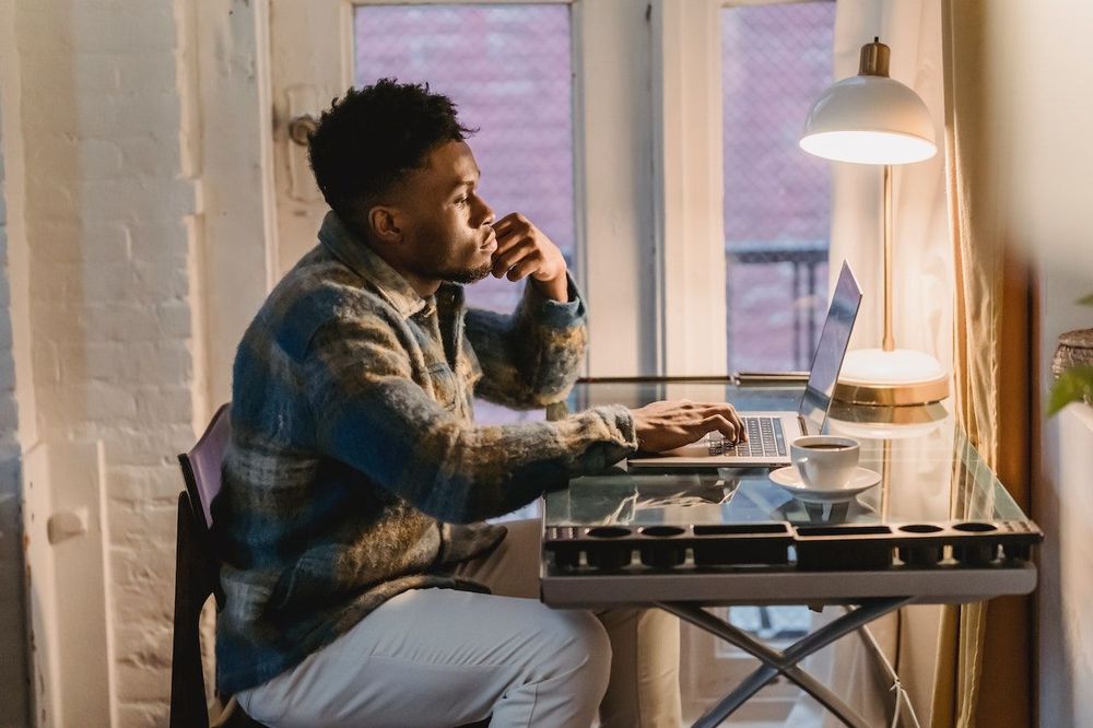 Freelancer works remotely near the window