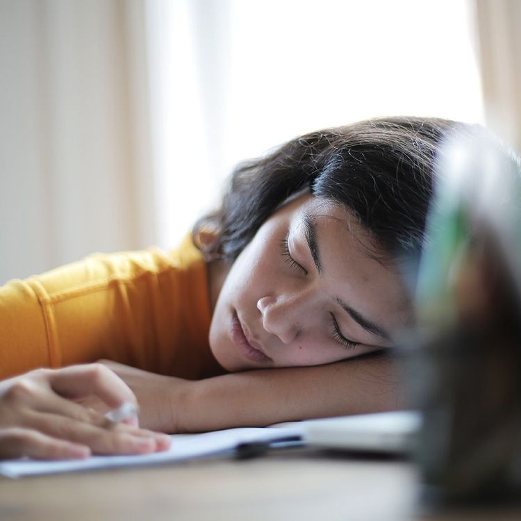 woman asleep at her desk