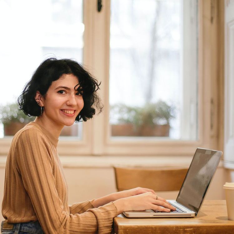 Smiling woman, satisfied that she chose freelancing over a full time job
