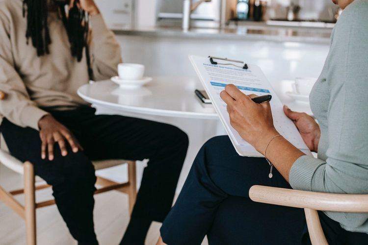 Small business owner interviewing a copywriter to help create content for their business